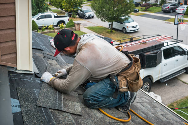 Professional Roofing technician working in East Poland, ME